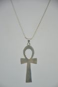 A fine snake linked necklace chain adorned with large crucifix cross. Pendant measures 6.