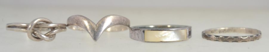 3 silver vintage rings to include swirl, mother of pearl inset and a thin eternity ring. Sizes P/N.