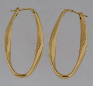 A pair of 925 silver gilt hoop earrings with post clip fasteners. Marked 925 . Measures 4.5cms.