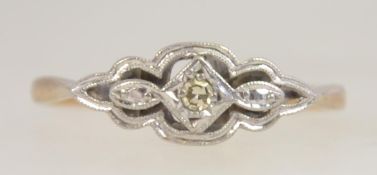 A 9ct gold and platinum diamond ring. The central stone approx 5pnts within swirl platinum setting.
