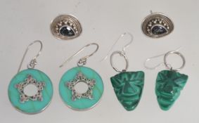 A pair of malachite and silve earrings of drop form on large silver scrolls together with a pair of