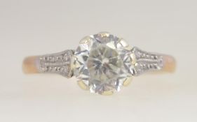 A 9ct gold and platinum white sapphire single stone ladies ring. The central stone approx 1.