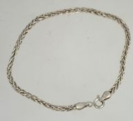 A silver rope linked bracelet / bangle with lobster clasp marked 925. Weight 4.