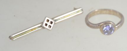 A silver 925 pink gemstone ring being round cut on suspension mount.