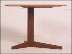 A Danish influence style coffee table of angular form raised on tri-splayed legs.