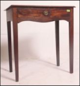 An 18th century Georgian mahogany writing table desk being raised on squared legs with fitted