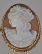 A 9ct gold hallmarked ladies cameo complete with safety chain.