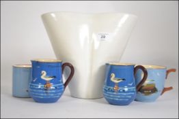 A collection of Torquay ware pottery to include seagull decorated cups along with a studio