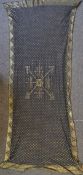 An assuit black and yellow metal wedding shawl of unusual design with hand stitched edges. Measures.