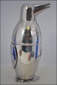 A silver plated novelty cocktail shaker in the form of a penguin H19cm
