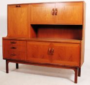 A 1970's G-Plan teak wood Danish style sideboard having an upright gallery back raised over