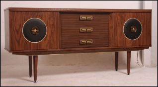 A 1950's retro melamine sideboard raised on tapered legs comprising drawers and cupboards 77cm high