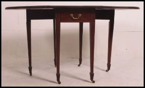 A 19th century mahogany drop leaf Pembroke table with satinwood inlay and cross banding on