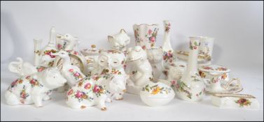 A large collection similar looking bone china collectables to include cat, pigs, cats,