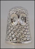 A novelty silver 925 thimble in the form of an owl H3cm 12.