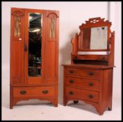 An Edwardian satin wood wardrobe with mirror panel door and single drawer along with a near
