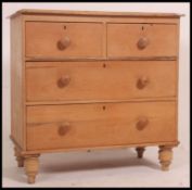 A 19th century Victorian pine two over two chest of drawers having two short over two long drawers