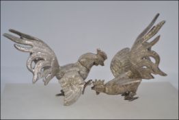 A pair of good silver plate fighting cocks - cockerels with eyes,