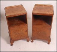 A pair of 1930's Queen Anne walnut bedside cabinets raised on stub cabriole legs with pad feet