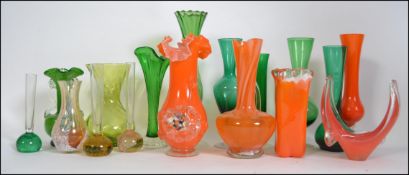 A collection of retro studio green glass to include vases,
