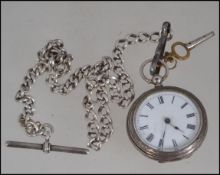 A white metal , ( stamped ' Warranted 800 silver ' )pocket watch , chain and key .