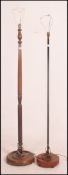 A retro 1970's teak standard lamp with ebonised metal tubular column together with another 20th
