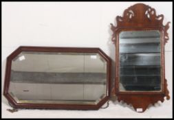 Two 19th / 20th century wall mirrors the first a bevel edged rectangular oak frame along with