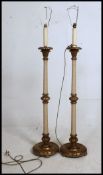 A good pair of mid century gilt plaster and string bound standard lamps,