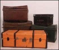A good stack of vintage tack / steamer trunks along with a tin deed box and a canvas and wooden