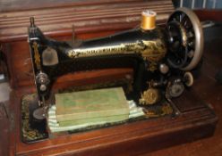 A late Victorian 19th century wooden inlay cased manual Singer Sewing machine,