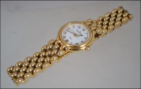 A gold plated quartz watch by Maurice Lecroix