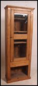 An early 20th century unusual pine shop cabinet display unit ( haberdashery ) having full length