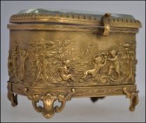 Small gilt metal casket , cherub to front , rear, and sides.