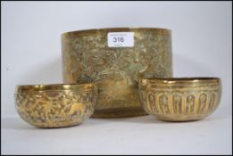 A group of 3 hand hammered Indian brass bowls ,