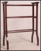 A good Victorian mahogany inlaid late 19th century towel rail raised on angular legs with turned