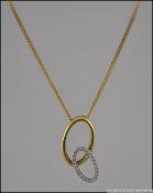 A 9ct gold and diamond necklace. This intertwined hoops adorned with 20pnts of 1pnt stones.