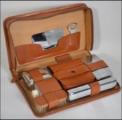 A mid century retro vintage leather zip around gentleman 's vanity set with chrome and leather