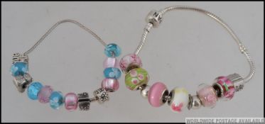 2 contemporary white metal silver charm bracelet bangles with colourful beads and adornments