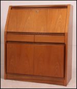 A 20th century large retro teak bureau desk.