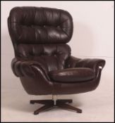 A 20th century vintage Danish swivel chair having bentwood frame with upholstered seat,