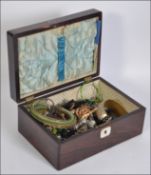 A rosewood box with a collection of various costume jewellery held within