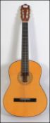 A six string acoustic Spanish style guitar by Hohner paper label to centre