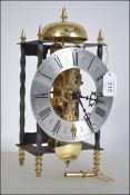 FRANZ HERMLE brass skeleton mantle clock, the spring driven movement striking on the top bell,