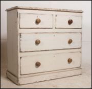 A Victorian painted pine shabby chic chest of drawers having white scrub finish with 2 short over 2