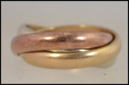 A hallmarked 9ct gold metamorphic Russian style stacking trilogy ring 4.