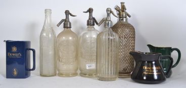 Breweriana A collection of vintage soda syphon bottles to include wire mesh,
