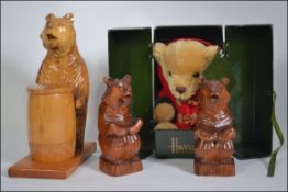 A set of 2 black forest carved dark wood bears, with a lighter ,