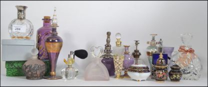 A large collection of 20th century perfume bottles / atomiser of varying styles to include cut