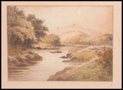 An early 20th century framed and glazed water colour of a highland scene together with a pastel of