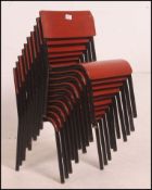 A stack of 10 mid 20th century childrens school chairs being raised on ebonised tubular metal